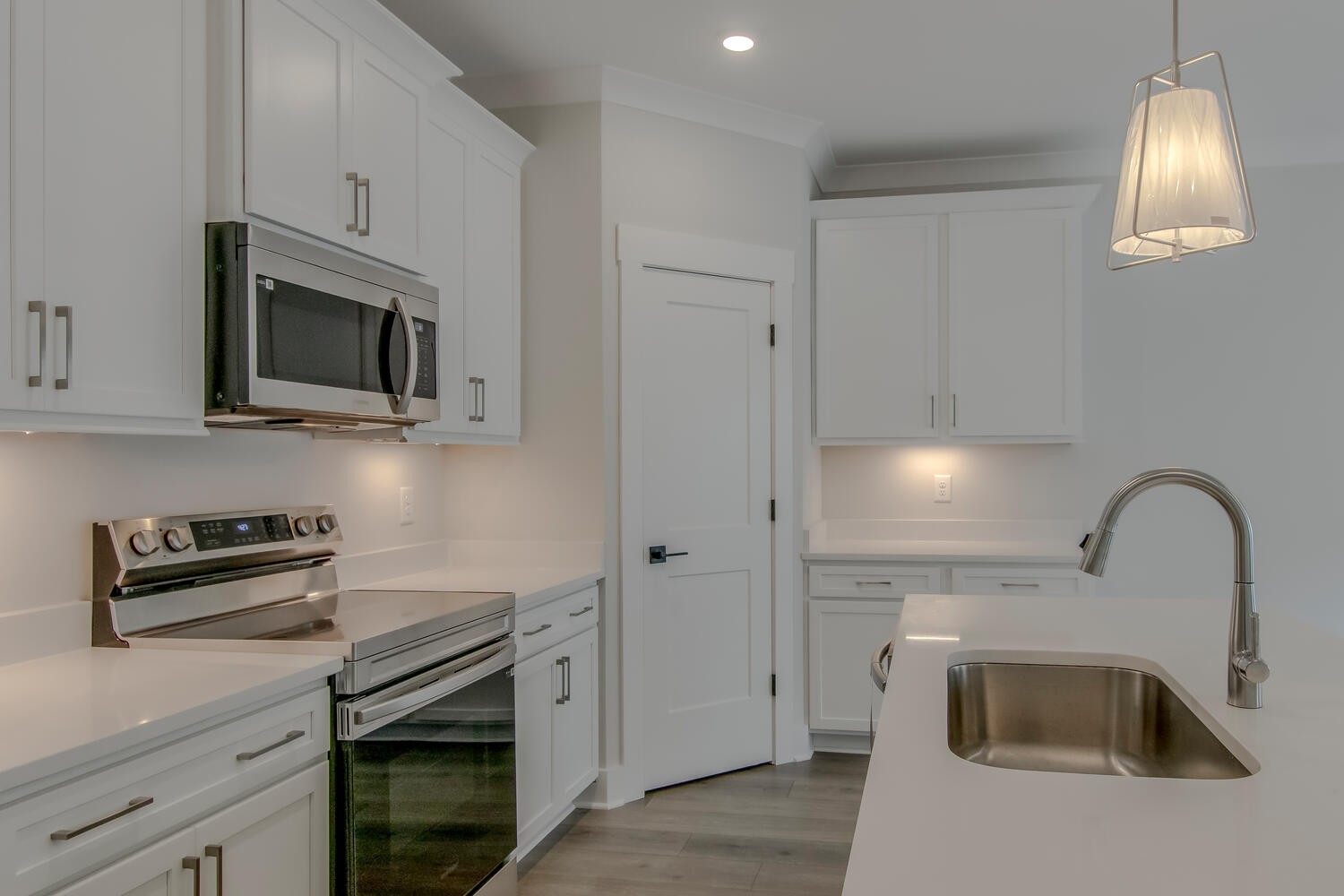 224 Tyler Cornerstone Trail Smyrna, TN 37167 - Photo 34 of 43 a kitchen with granite countertop a stove a sink and a microwave
