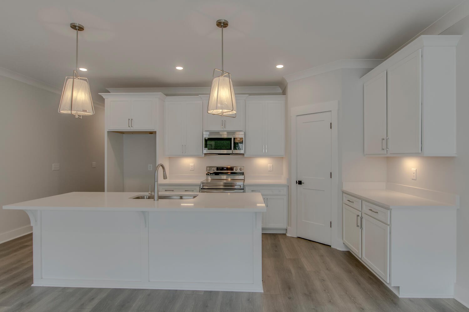 224 Tyler Cornerstone Trail Smyrna, TN 37167 - Photo 36 of 43 a kitchen with kitchen island white cabinets and stainless steel appliances