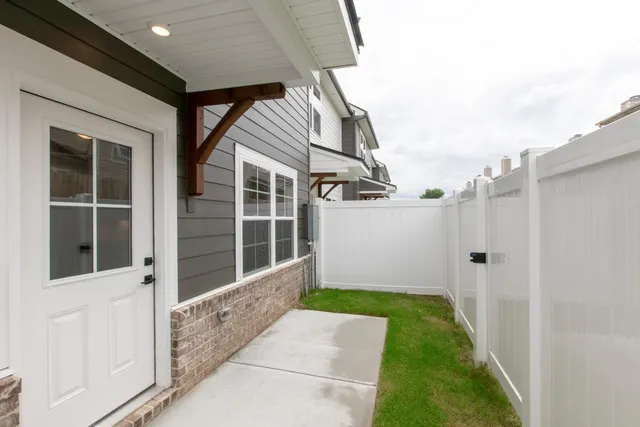 a view of an entrance to house with yard