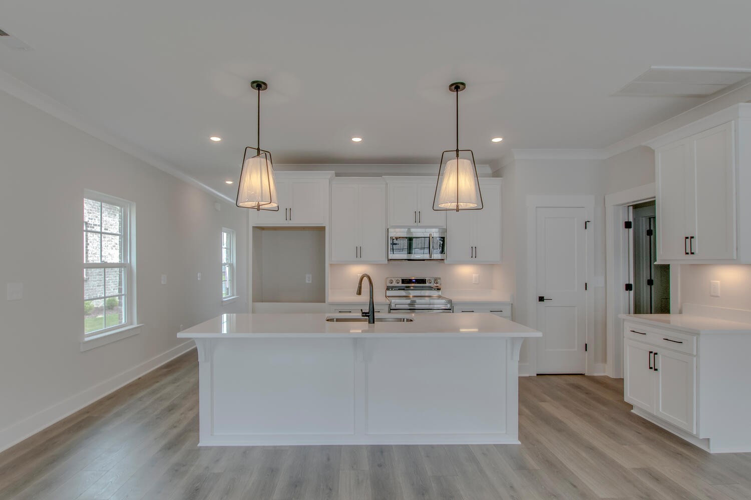 224 Tyler Cornerstone Trail Smyrna, TN 37167 - Photo 8 of 43 a large kitchen with stainless steel appliances granite countertop a sink a oven a center island a stove and a window