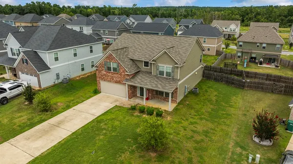 an aerial view of a house with a garden