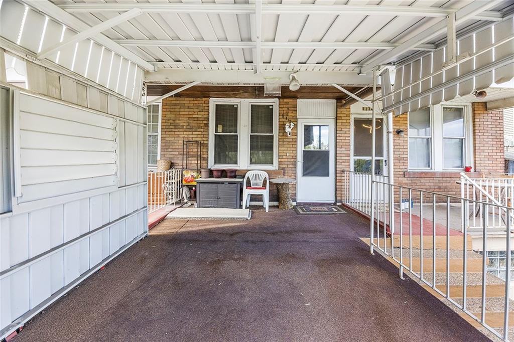 1136 Taggart Street McKees Rocks, PA 15136 - Photo 2 of 10 a view of a porch with a table and chairs