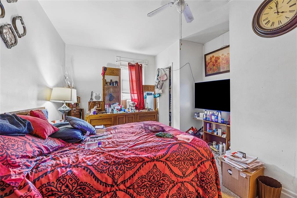 1136 Taggart Street McKees Rocks, PA 15136 - Photo 7 of 10 a bedroom with a bed and a flat screen tv