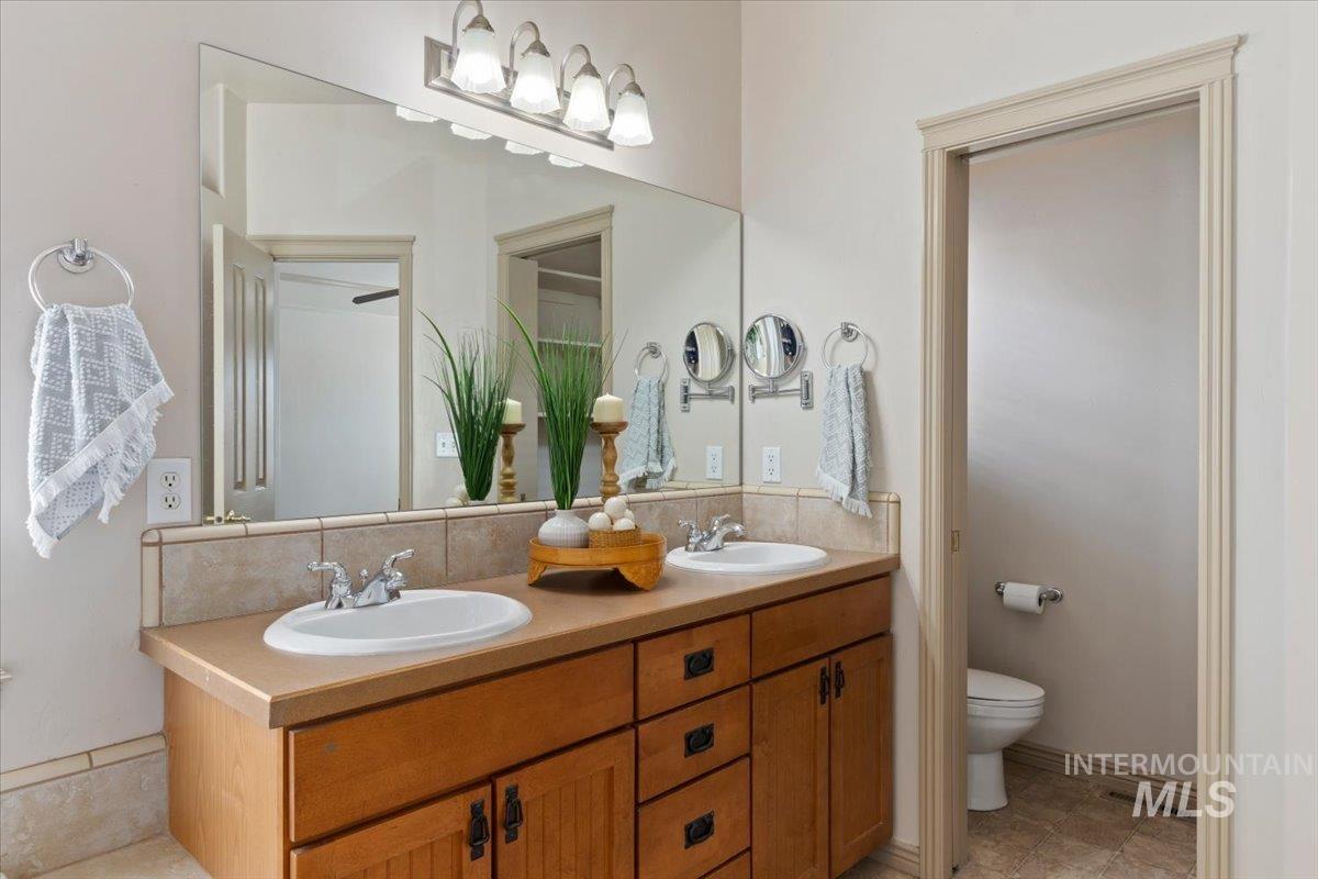 2274 Eastwood Road Twin Falls, ID 83301 - Photo 18 of 38 Dual vanity with wood cabinetry and brushed nickel hardware