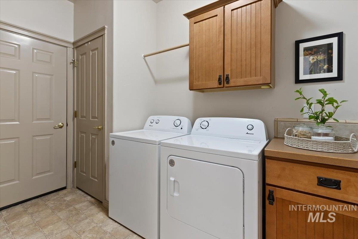 2274 Eastwood Road Twin Falls, ID 83301 - Photo 30 of 38 Dedicated laundry area featuring a wood-finish upper cabinet, a wood-finish lower cabinet with a countertop, and durable tile-look flooring