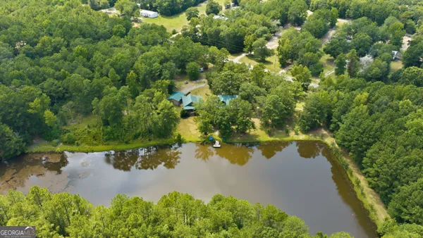 an aerial view of a houses with yard