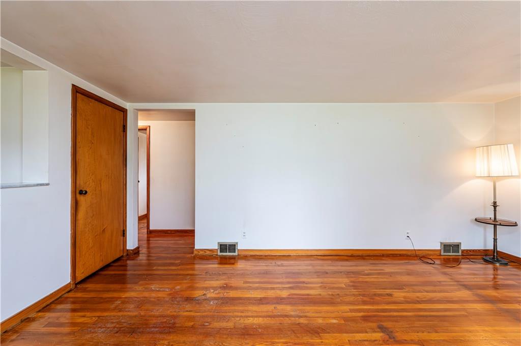 13740 Ridge Road Irwin, PA 15642 - Photo 14 of 43 a view of empty room with wooden floor