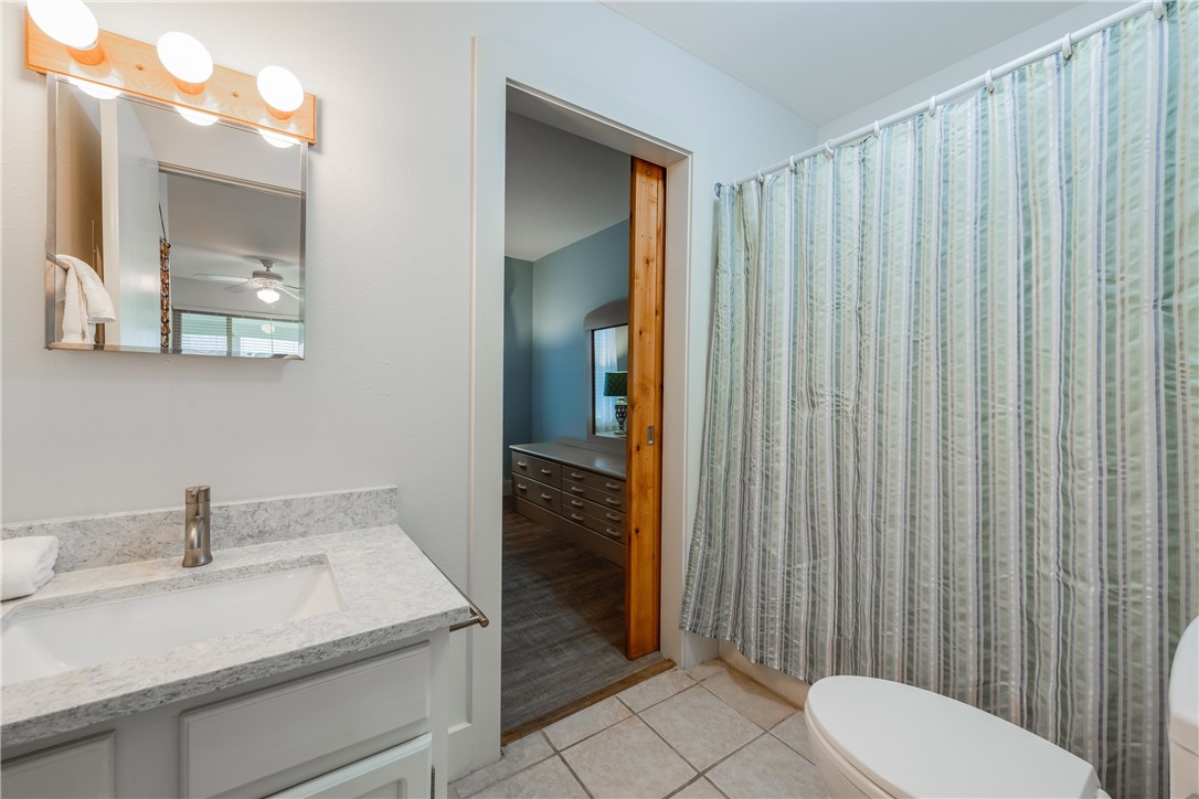 622 Beach Access Road, Unit 225 Port Aransas, TX 78373 - Photo 21 of 21 a bathroom with a sink and toilet