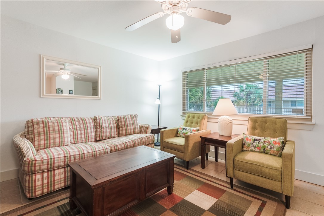 622 Beach Access Road, Unit 225 Port Aransas, TX 78373 - Photo 10 of 21 a living room with furniture and a large window