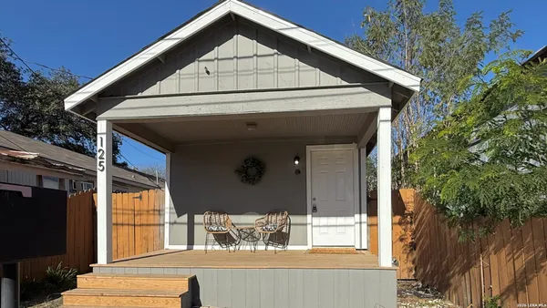 a view of a house with a large window