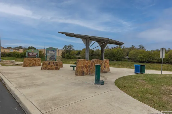 a view of a patio with a table and chairs