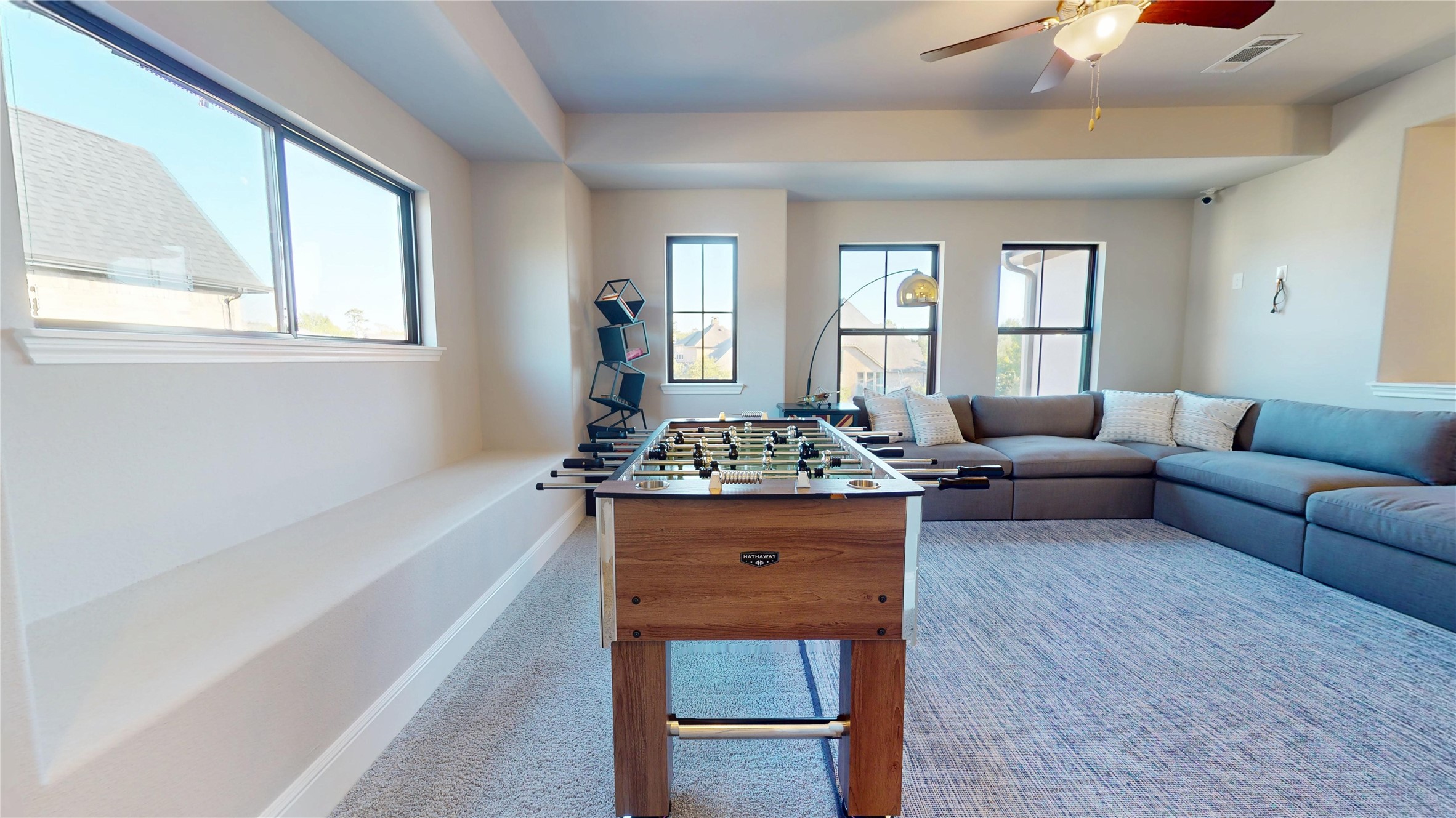 8305 Greenleaf Ridge Way Conroe, TX 77385 - Photo 23 of 33 a living room with furniture and a table