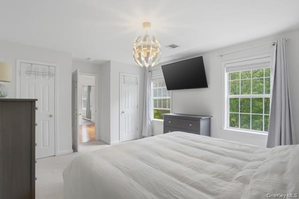 29 Hickory Hill Road Newburgh, NY 12550 - Photo 27 of 47 a bedroom with a bed and a flat screen tv