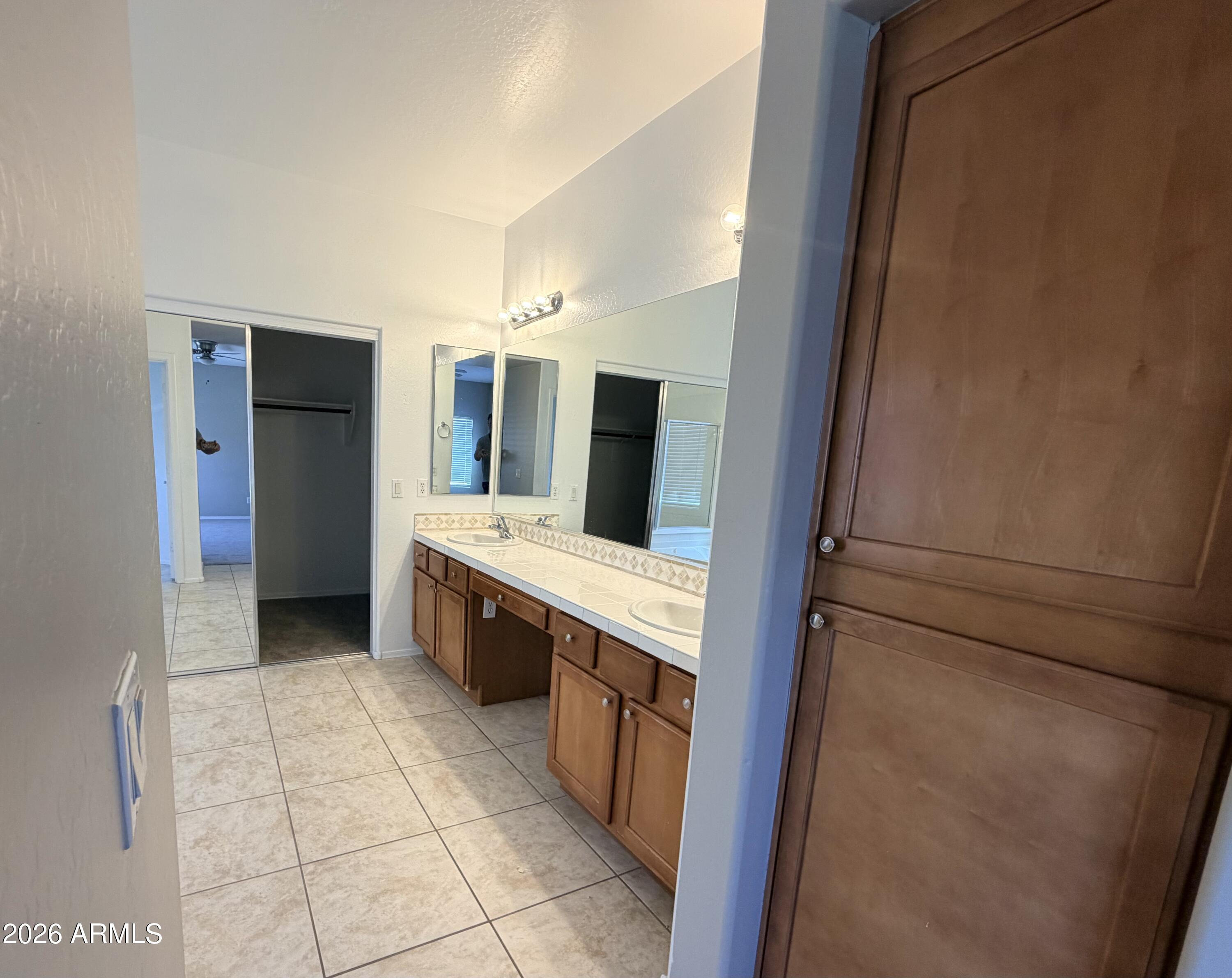 191 West Rio Drive Casa Grande, AZ 85122 - Photo 17 of 34 a large bathroom with a double vanity sink and a mirror