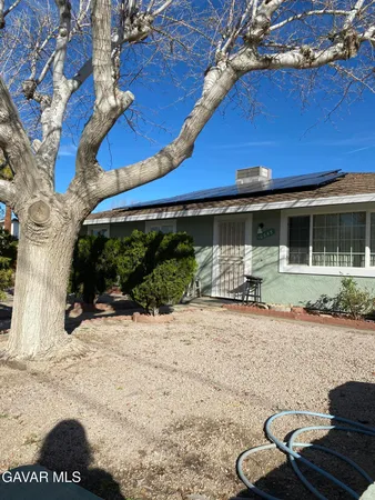 a backyard of a house with seating space