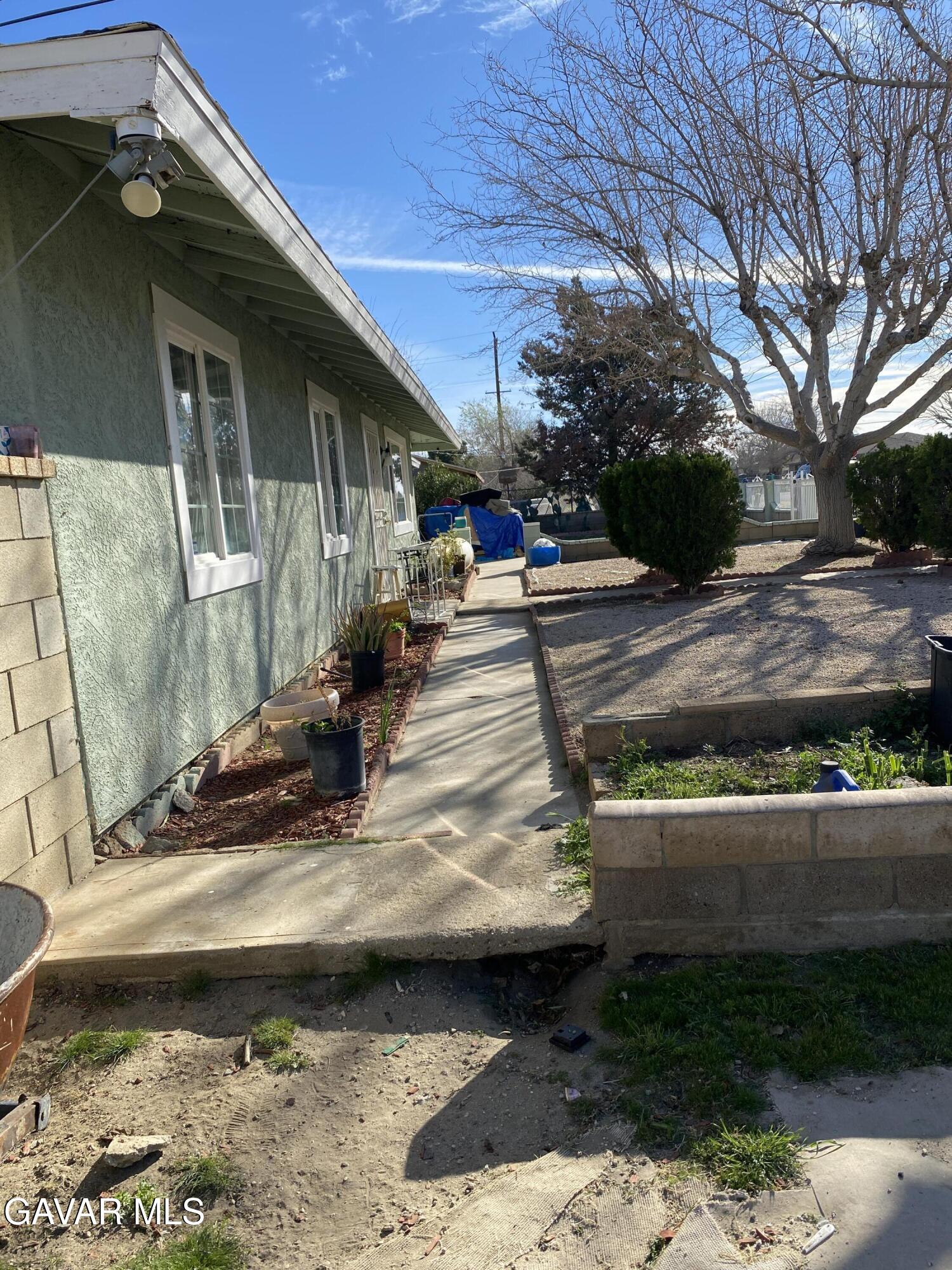 10845 East Ave R-2 Littlerock, CA 93543 - Photo 4 of 4 a view of a yard with car parked