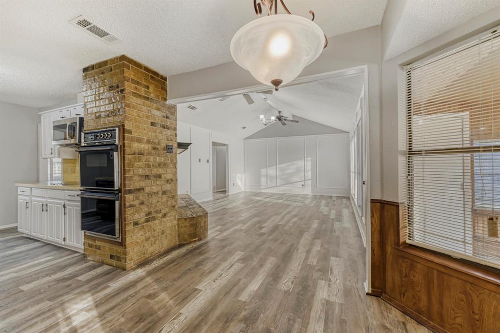 517 Kings Gate Road Willow Park, TX 76087 - Photo 12 of 28 a spacious bathroom with a granite countertop sink a mirror and shower