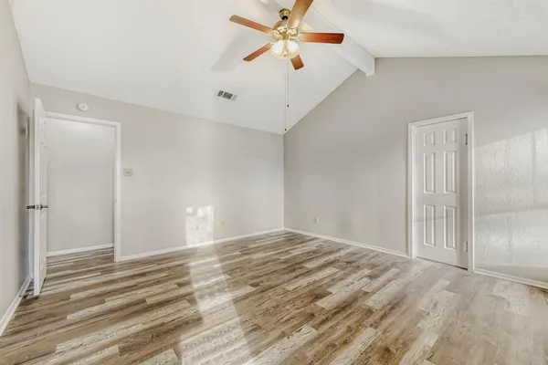 a spacious bathroom with a shower sink and mirror
