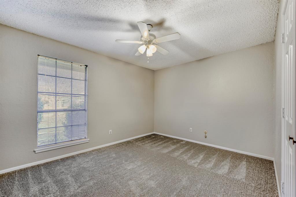 517 Kings Gate Road Willow Park, TX 76087 - Photo 23 of 28 an empty room with windows and fan