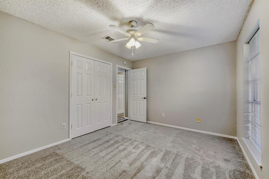 517 Kings Gate Road Willow Park, TX 76087 - Photo 24 of 28 a view of an empty room with a ceiling fan