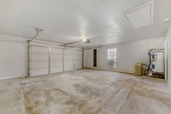 a view of a yard with large trees