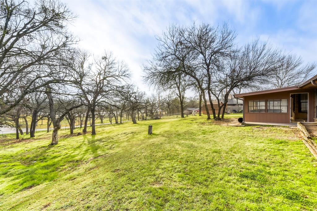 517 Kings Gate Road Willow Park, TX 76087 - Photo 27 of 28 a view of swimming pool with trees