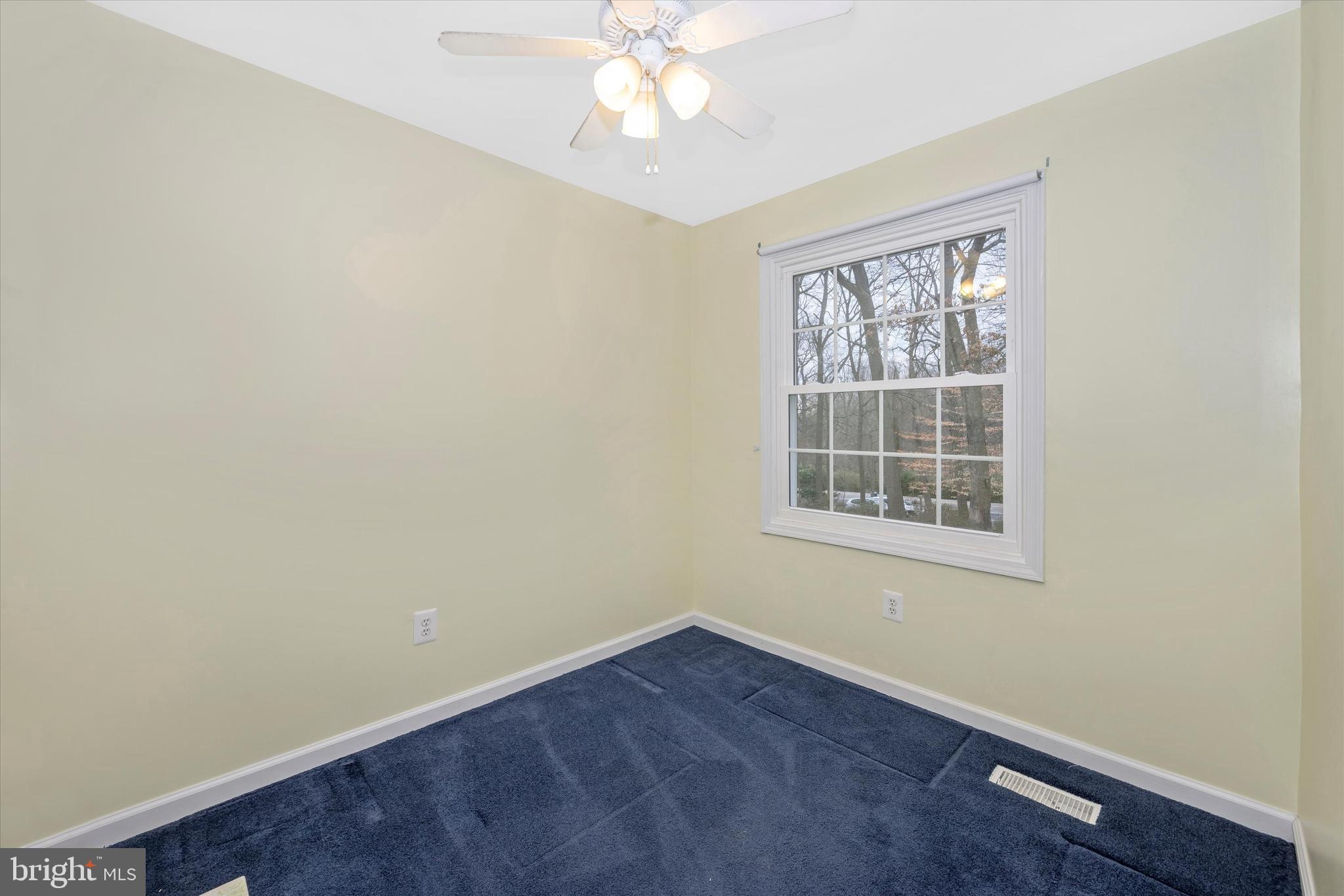 8137 Murphy Road Fulton, MD 20759 - Photo 21 of 56 an empty room with a window and a fan