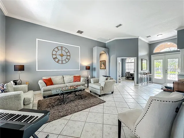 a large kitchen with stainless steel appliances granite countertop a stove and cabinets