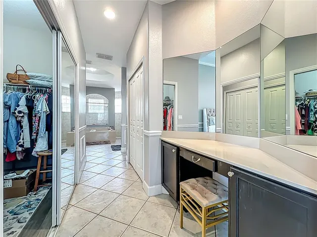 a room with pool table and windows