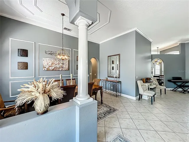 a living room with fireplace furniture and a window