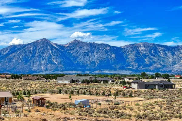a view of a chairs and table in the patio