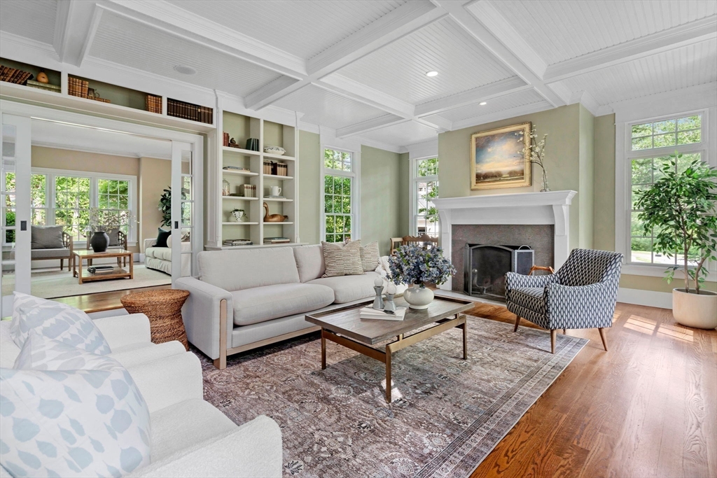 200 Edgewater Drive Needham, MA 02492 - Photo 13 of 41 a living room with furniture potted plant and a fireplace