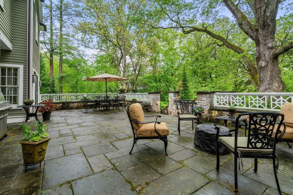 200 Edgewater Drive Needham, MA 02492 - Photo 14 of 41 a view of a chairs and table in the patio