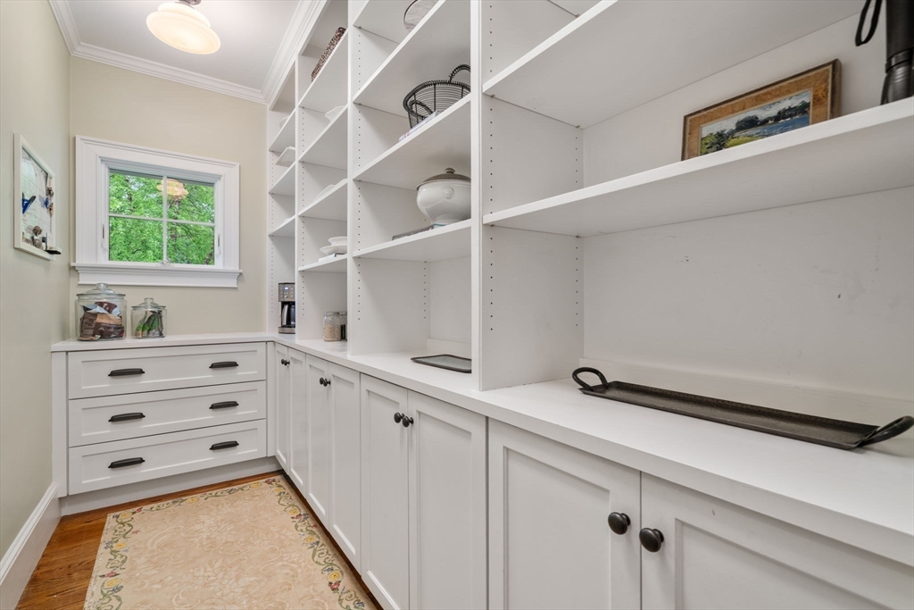 200 Edgewater Drive Needham, MA 02492 - Photo 17 of 41 a kitchen with cabinets appliances and a window