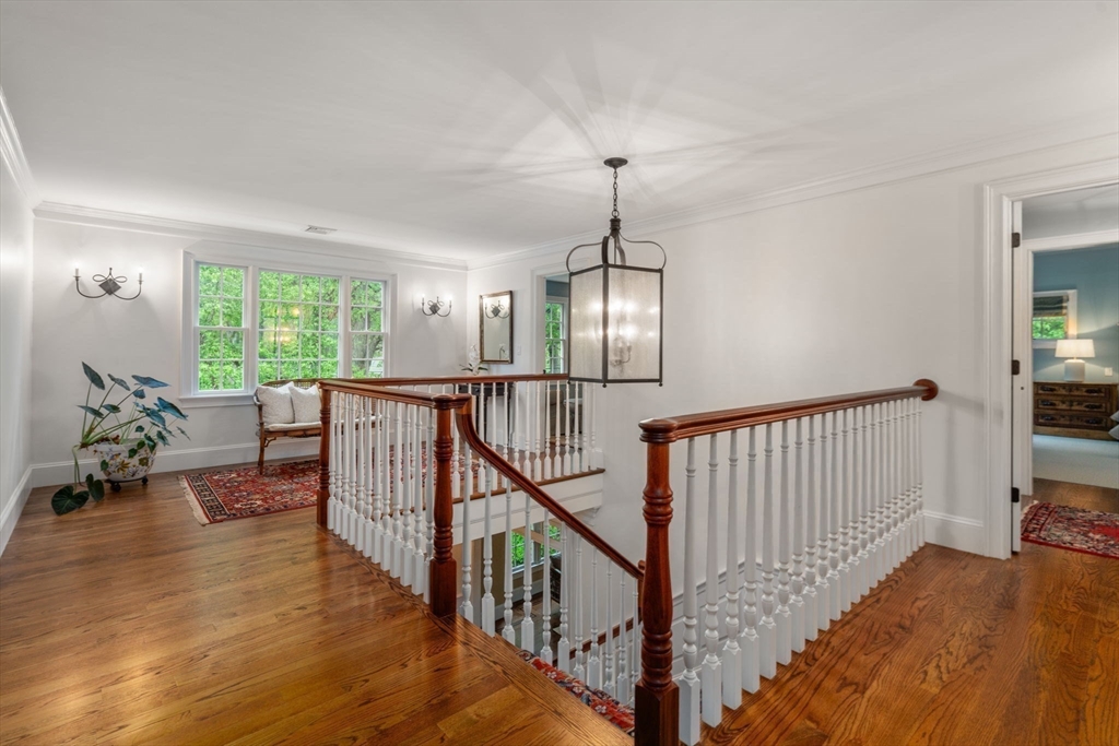 200 Edgewater Drive Needham, MA 02492 - Photo 21 of 41 a view of a livingroom with furniture wooden floor windows and a chandelier