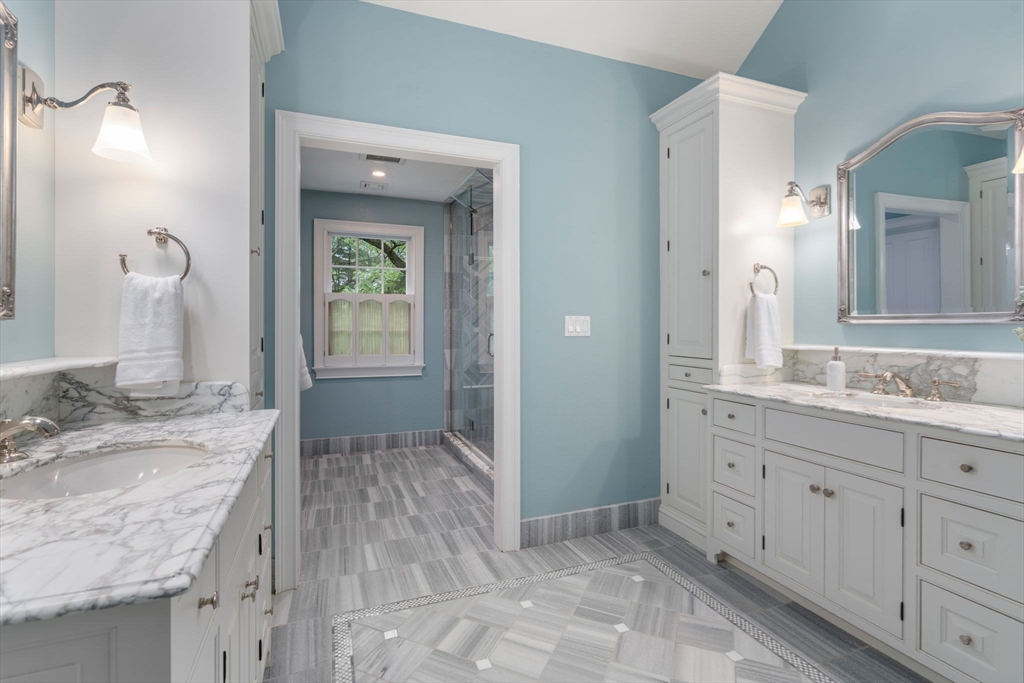 200 Edgewater Drive Needham, MA 02492 - Photo 24 of 41 a bathroom with a granite countertop sink and a mirror