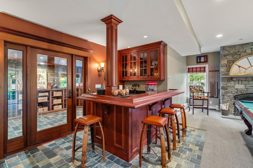 200 Edgewater Drive Needham, MA 02492 - Photo 33 of 41 a dinning table and chairs in a room
