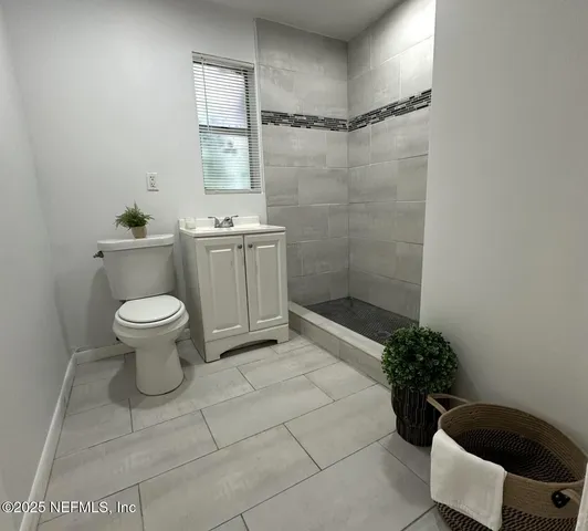 a bathroom with a toilet and a sink