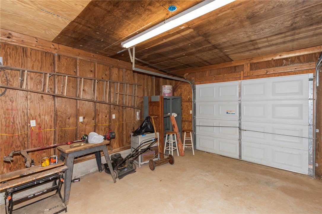 1116 Leatherdale Road Iva, SC 29655 - Photo 23 of 46 This spacious garage offers ample room for vehicles and storage with a durable concrete floor.