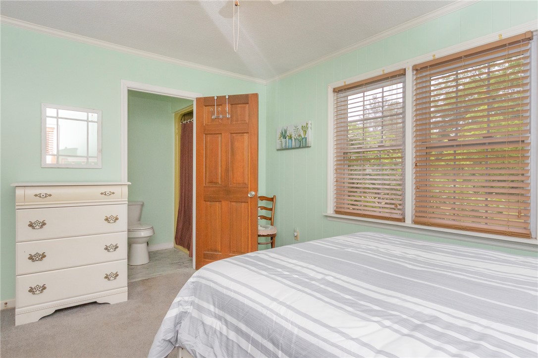 1116 Leatherdale Road Iva, SC 29655 - Photo 26 of 46 This cozy bedroom features a private attached bathroom and natural light.