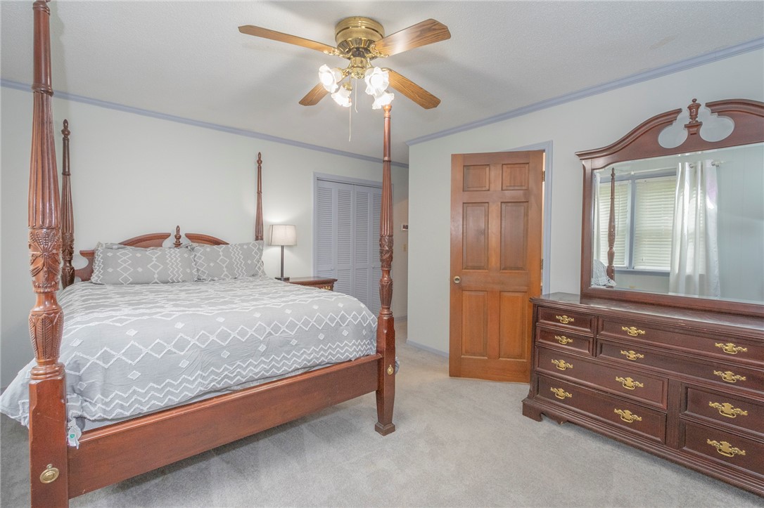 1116 Leatherdale Road Iva, SC 29655 - Photo 30 of 46 This cozy bedroom offers a tranquil retreat with soft lighting and comfortable carpeting.