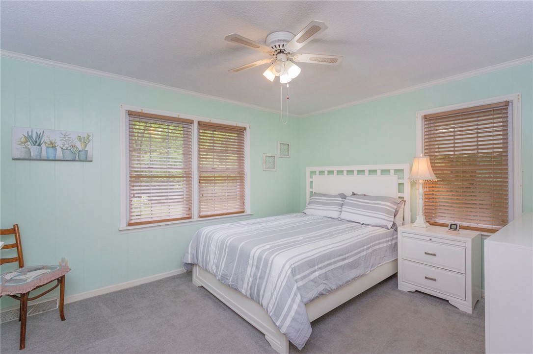 1116 Leatherdale Road Iva, SC 29655 - Photo 35 of 46 This serene bedroom offers a tranquil retreat with soft lighting and cozy appointments.