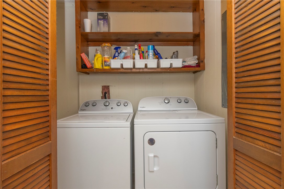 1116 Leatherdale Road Iva, SC 29655 - Photo 37 of 46 This dedicated laundry space combines convenience with practical storage solutions.