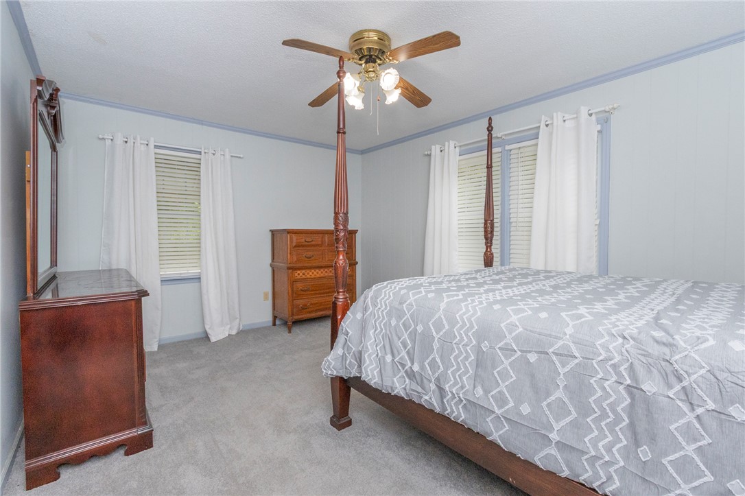 1116 Leatherdale Road Iva, SC 29655 - Photo 38 of 46 This spacious bedroom offers ample natural light and a serene atmosphere.