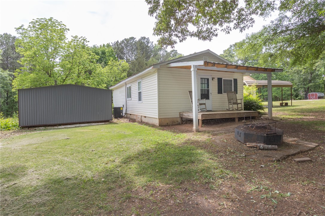 1116 Leatherdale Road Iva, SC 29655 - Photo 42 of 46 This charming home offers a relaxed outdoor living experience with a spacious yard and inviting porch.