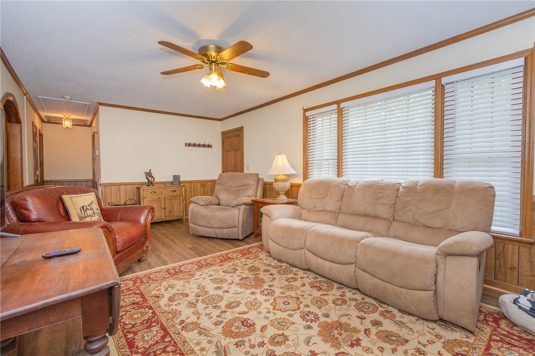 1116 Leatherdale Road Iva, SC 29655 - Photo 43 of 46 This inviting living area features warm wood accents and abundant natural light.