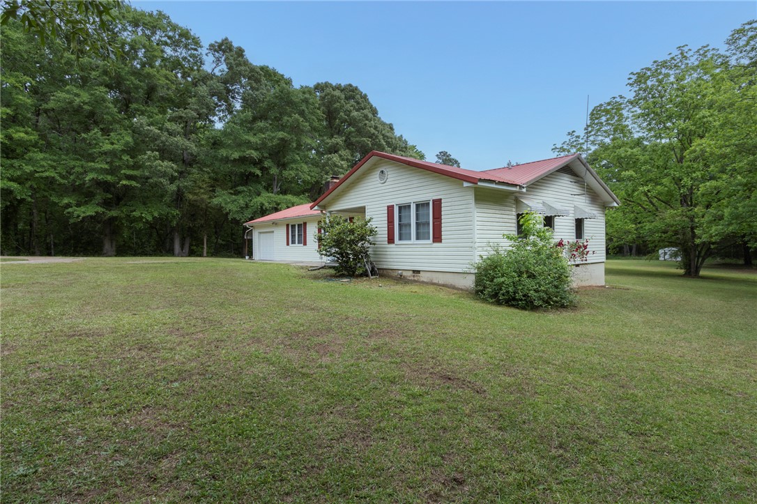 1116 Leatherdale Road Iva, SC 29655 - Photo 6 of 46 This charming home offers ample outdoor space with mature trees, perfect for relaxed living.