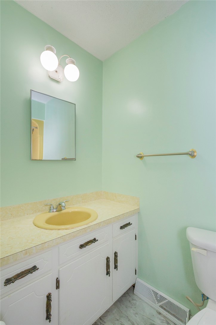 1116 Leatherdale Road Iva, SC 29655 - Photo 7 of 46 This bathroom features a functional vanity with ample storage and a cheerful sink.