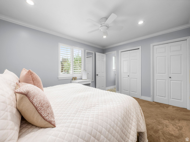 523 Mountain View Road Centerville, UT 84014 - Photo 9 of 33 Carpeted bedroom with two closets, crown molding, recessed lighting, and ceiling fan