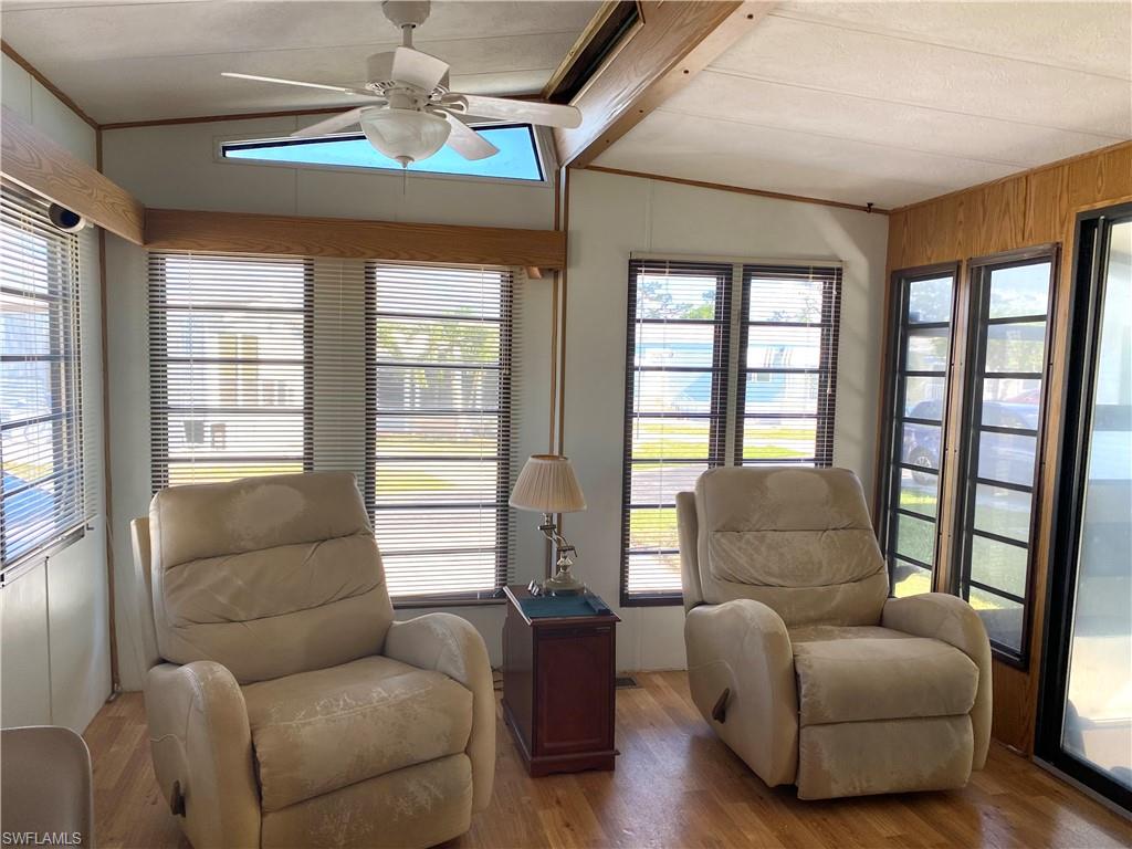 4561 Split Log Lane East Estero, FL 33928 - Photo 3 of 8 a living room with furniture and a large window